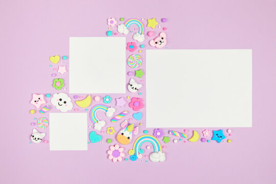 Three blank white cards on pastel purple background with frame of cute kawaii air plasticine handmade cartoon animals, rainbows. Empty photo frames, baby's photo book, scrapbooking design template