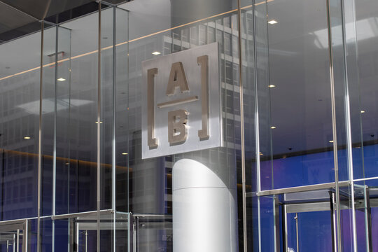 New York, NY, USA - July 6, 2022: AB logo is seen at the entrance to the AllianceBernstein Building in Midtown Manhanttan, New York. AllianceBernstein Holding L.P. is a global asset management firm.