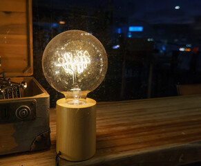 Light bulb on shop window display.