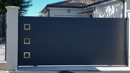 grey steel modern gate aluminum facade portal of home door of suburbs house entrance in street view