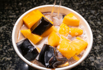 angle view bowl of mango coconut jelly syrup