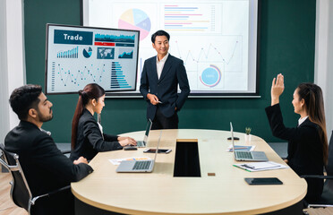 Asian business people team analyzing statistics financial. Team of businesspeople Meeting Conference Discussion Corporate Concept in office.