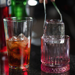 Barman Adds Giant Ice Cube to Negroni Cocktail