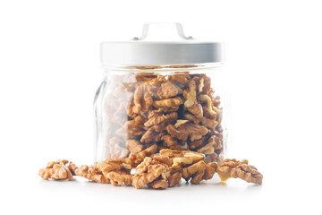 Peeled dried walnut kernels in jar isolated on white background.