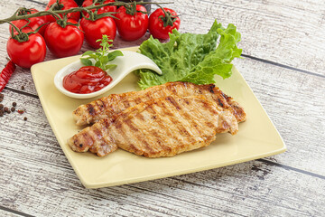 Grilled pork steak with ketchup