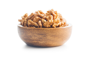 Peeled dried walnut kernels in bowl isolated on white background.