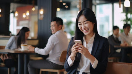 Smiling woman using mobile phone sitting in coffee bar - obrazy, fototapety, plakaty