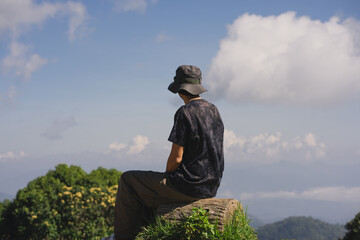 landscape and travel concept with solo freelancer man work and see cloud and sky with layer of...