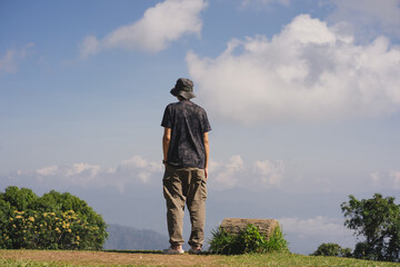 landscape and travel concept with solo freelancer man work and see cloud and sky with layer of...