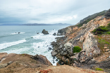 The raw power and beauty of the ocean, close-up, rocky sea cliffs, beautiful dramatic seascape of the Pacific Bay, California, USA. 