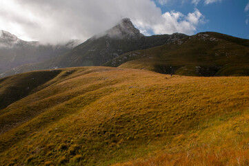 Dramatic clouds and mountains, ragged peaks in natural landscape in the Outeniqua mountains in the fynbos region of the western cape 