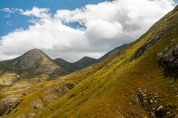 Dramatic clouds and mountains, ragged peaks in natural landscape in the Outeniqua mountains in the fynbos region of the western cape 