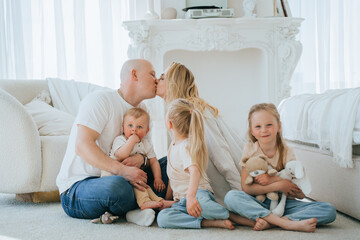 Affectionate family moment with a kiss, capturing love and tenderness at home