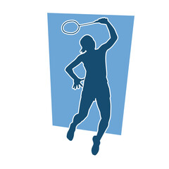 Silhouette of female badminton athlete in action pose. Silhouette of a slim woman playing badminton sport.