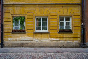 old vintage storefront facade , yellow painted boutique entrance , commercial  vitrine template