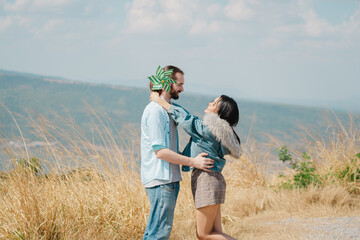 Young Couple Having Fun On Mountain Holiday Together. Valentine's Day concept. Lovers celebrating Valentine's Day.