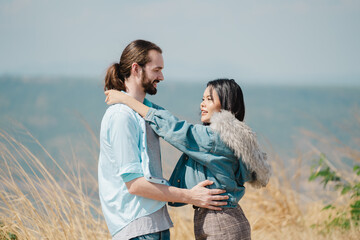 Young Couple Having Fun On Mountain Holiday Together. Valentine's Day concept. Lovers celebrating Valentine's Day.