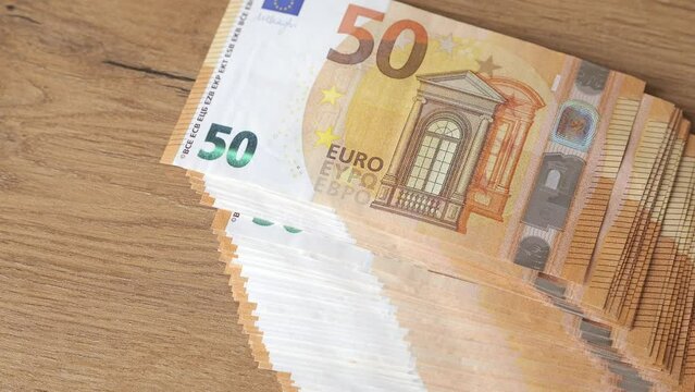 50 euro banknotes falling on the table