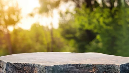 Rolgordijnen Stone podium table top outdoors blur green forest plant nature background © ROKA Creative