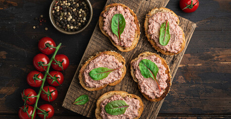 bruschetta with homemade liver pate on rustic wooden background, view from above  - obrazy, fototapety, plakaty