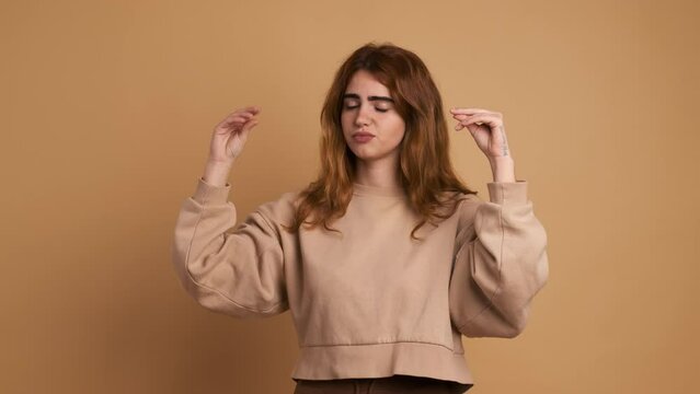 Young woman saying bla bla with hands gestures