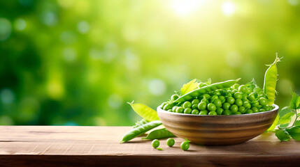 Green peas in a bowl against the backdrop of the garden. Selective focus.
