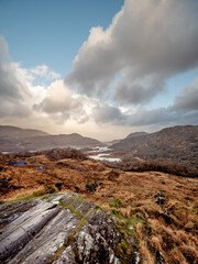 Wonderful nature scene with mountains and dark dramatic sky. Ladies view, Killarney, Ireland, ring of Kerry route. Magnificent Irish nature and popular travel and tourist area. Dark and moody look.