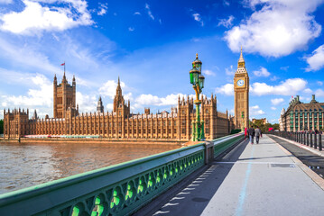 London, United Kingdom. Big Ben and Parliament Building, beautiful blue sky with white clouds.