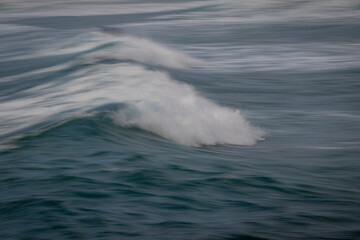 Panning shot of a breaking wave.