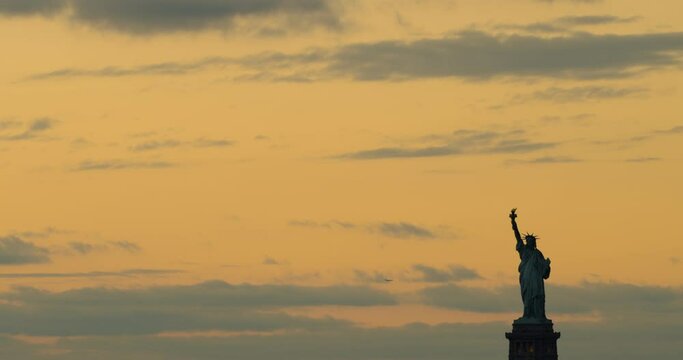 Statue of Liberty Lights Coming on at Sunset
