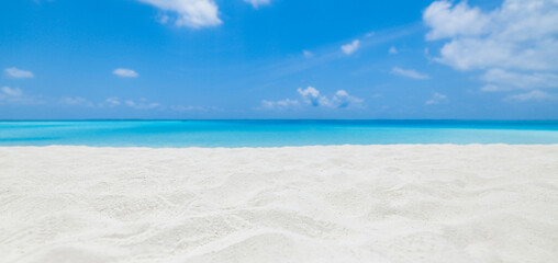 Closeup sandy beach, sunny blue sea sky. Panoramic beach landscape. Empty tropical beachfront and...