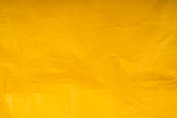 Bright yellow sack texture background.