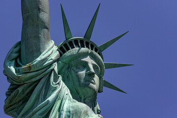 The Statue of Liberty with its crown is the democratic symbol of New York (USA) and the Big Apple, famous in Manhattan and around the world.