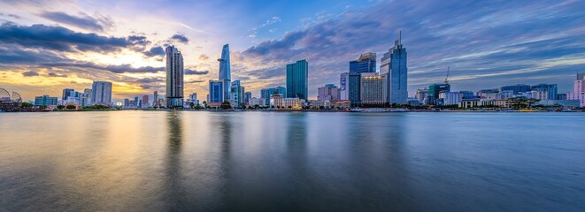 Panoramic image of Ho Chi Minh City viewed from the other side of the Sai Gon River on sunset in Ho Chi Minh City, Vietnam