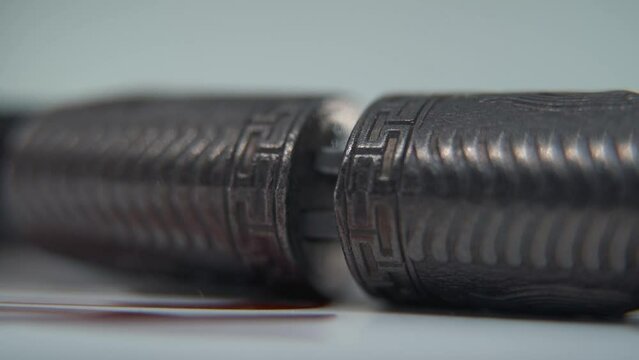 A detailed macro shot of two ancient silver knifes closing, Chinese antique weapon, historical vintage blade, old textured steel, traditional dagger, professional light, cinematic slow motion 120 fps