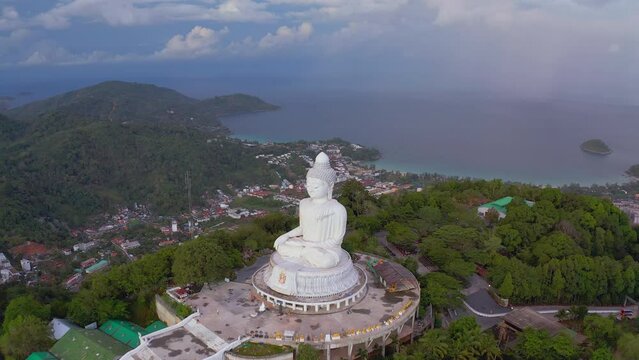 Phuket Big Buddha statue, beautiful drone shot in morning sun light. Aerial view landscape of Giant sculpture.