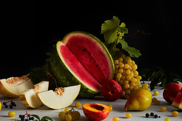 Still Life with Grapes and Sliced Watermelon, melon, peach on Dark Background