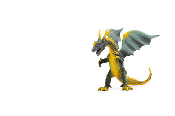 Fototapeta premium Plastic dragon toy on white background. The Simbol of new year 2024.
