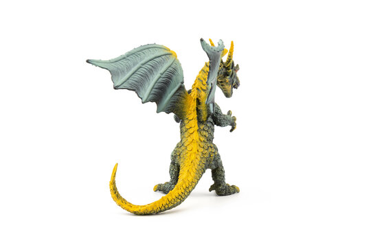 Plastic dragon toy on white background. The Simbol of new year 2024.