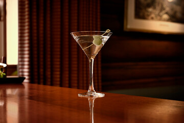 Close-up shot of a martini glass on a bar table