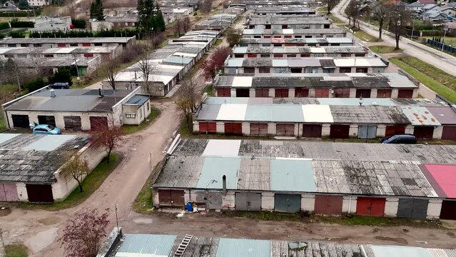 Establishing, Aerial view of privately owned old fashioned car garages from soviet Era in Lithuania, Silute. Europe.