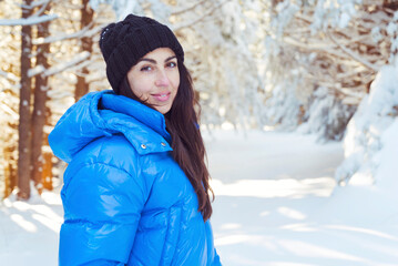 Beautiful woman with warm blue jacket walking in the winter mountain .Vitosha ,Bulgaria 