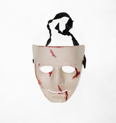 white theatrical mask with blood isolated on white background