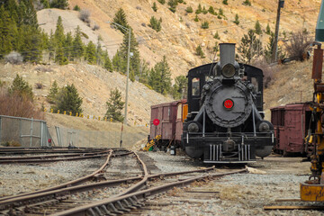 Front view of steam locomotive of Georgetown loop railroad in Colorado, USA. Engine is parked in a...