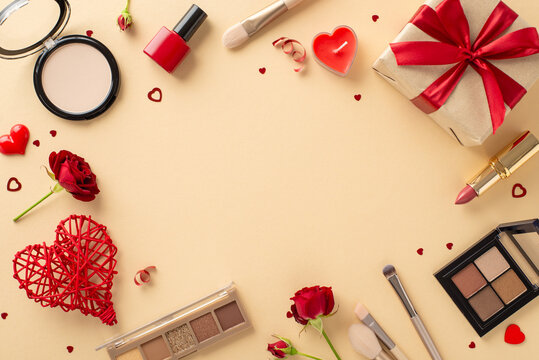 Romantic gift hunt for her: Lipstick, brushes, eyeshadow palettes, nail polish, and more. Top view on a pastel background with roses, hearts, confetti and a gift box. Advertise with love