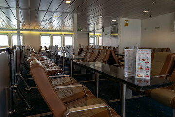 The empty restaurant of a ferry crossing the sea. High quality photo. Travelling, bar, empty, alone