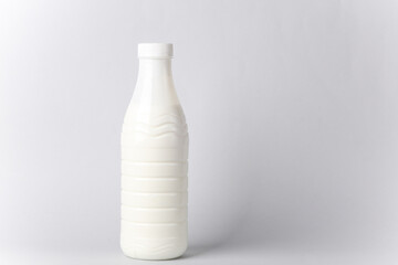 Plastic bottle of milk or kefir mockup on gray background
