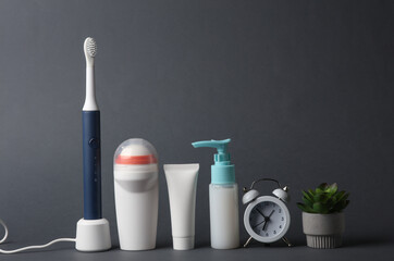 Personal hygiene products on dark gray background
