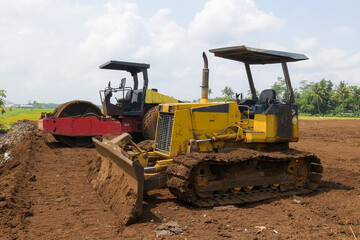 Obraz premium Bulldozer at land clearing construction site