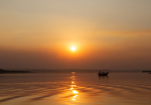 Sunset And Fisherman Boat At Bhigwan Bird Sanctuary, India